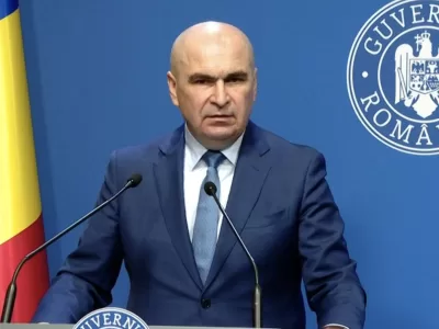 Decizia radicală luată de Bolojan. E vorba de Oana Țoiu